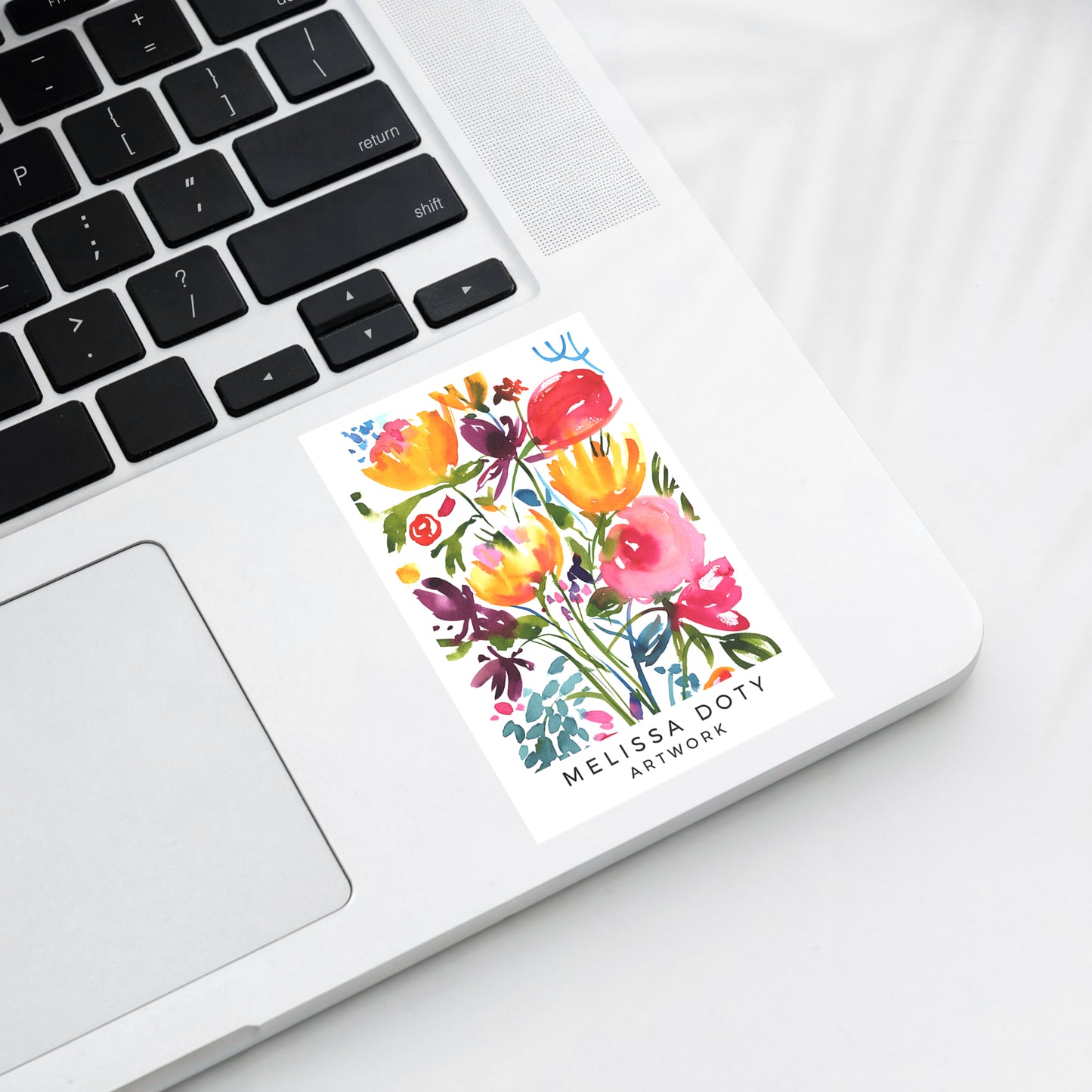 Colorful abstract floral sticker on laptop