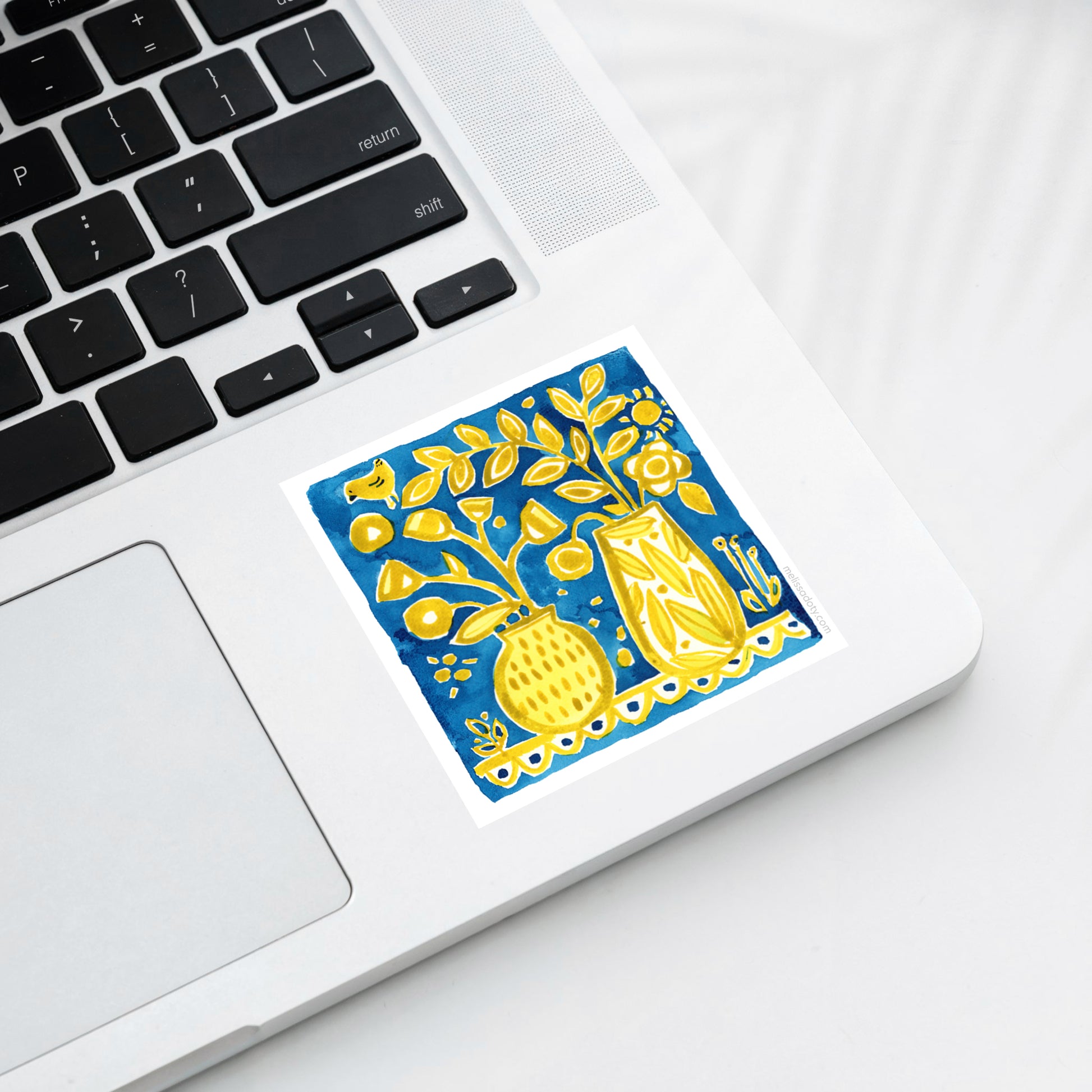 Blue and yellow watercolor floral vinyl sticker on laptop