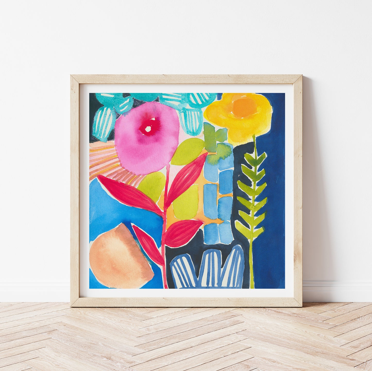 Framed colorful abstract floral art print on a white wall